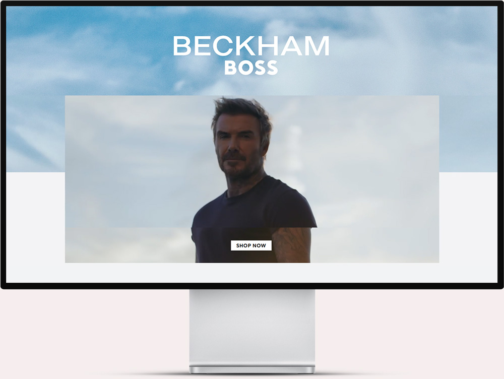 Computer screen displaying an advertisement featuring a man with short hair and tattoos wearing a dark shirt, with the text 'BECKHAM BOSS' above and a 'SHOP NOW' button below.