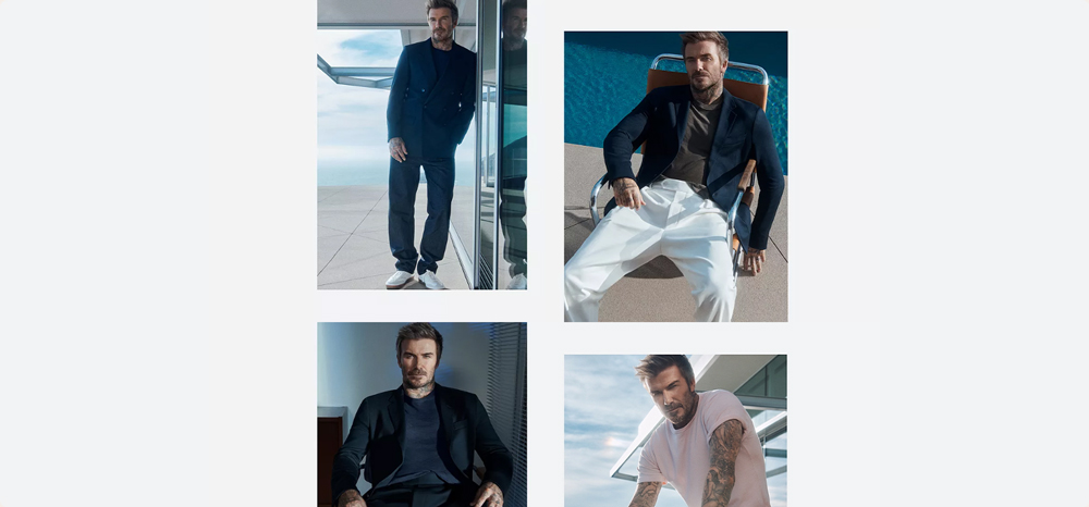 Four photos of a man with beard and styled hair wearing different outfits: dark suit with white sneakers standing by a glass wall; black blazer and white pants sitting on a chair near a pool; dark suit and sweater sitting indoors; white t-shirt showing tattooed arms leaning outdoors with sky background.
