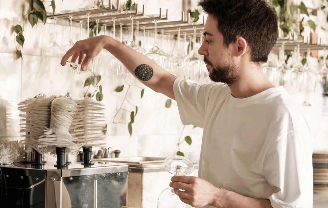 Image of the a man cleaning glasses