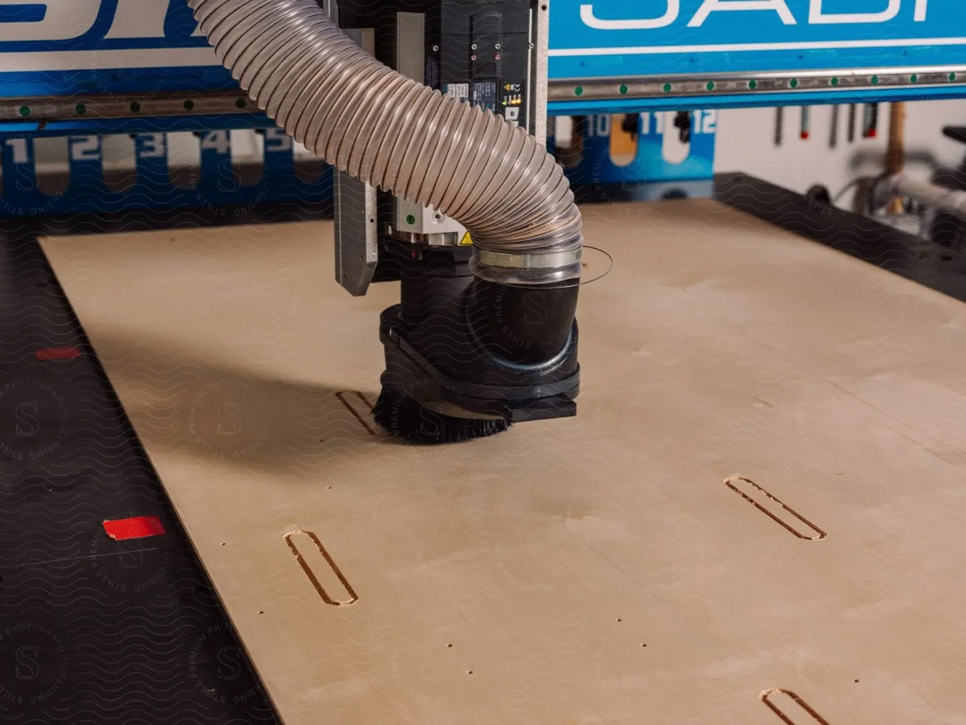 CNC router cutting sheet material on a factory floor