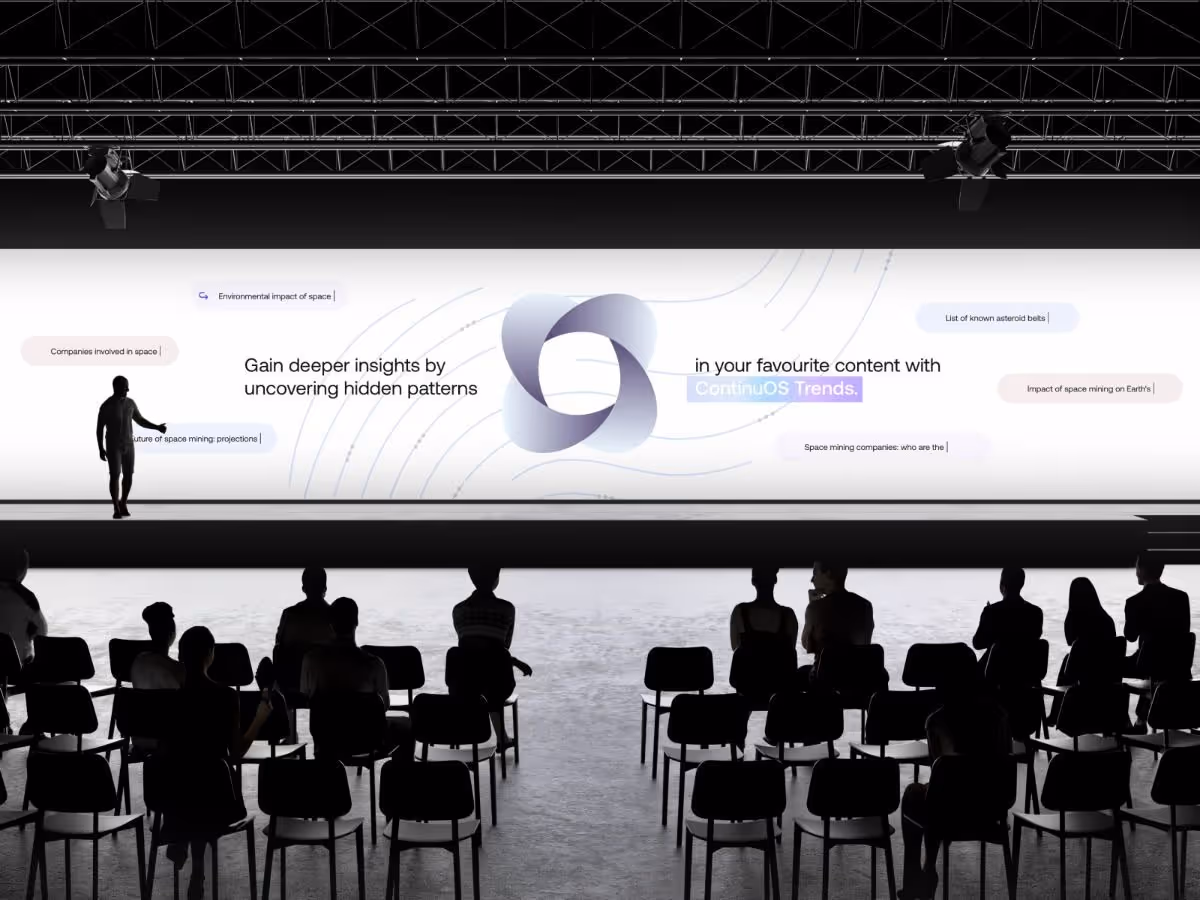 A speaker on stage presents to an audience, showcasing a large screen with text: "Gain deeper insights by uncovering hidden patterns." The setting is a tech conference with a futuristic, informative tone.