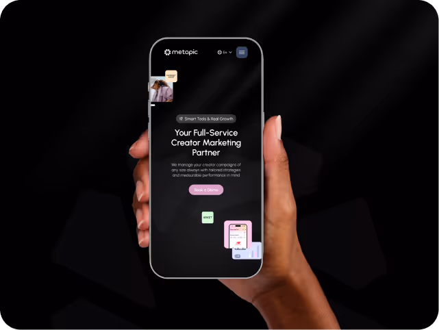A hand holds a smartphone displaying a marketing app interface on a black background. Text reads, "Your Full-Service Creator Marketing Partner."