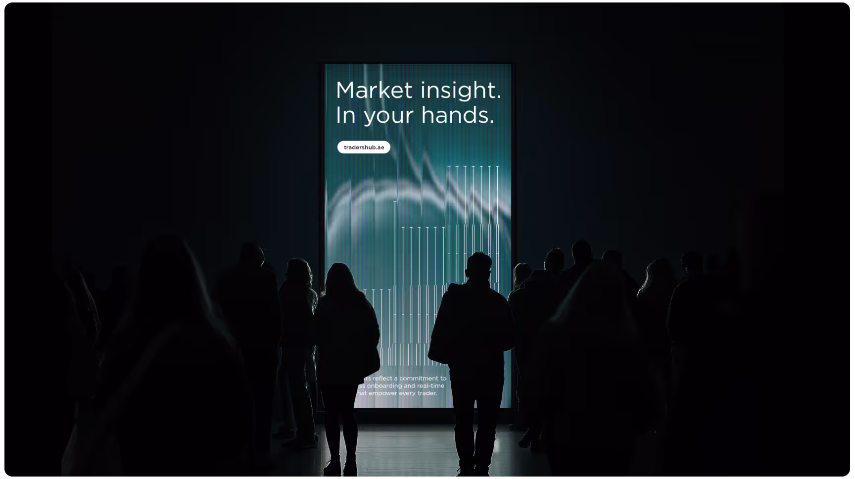 Silhouetted crowd stands before a glowing digital screen in a dark space, displaying the text "Market insight. In your hands" and financial graphics.