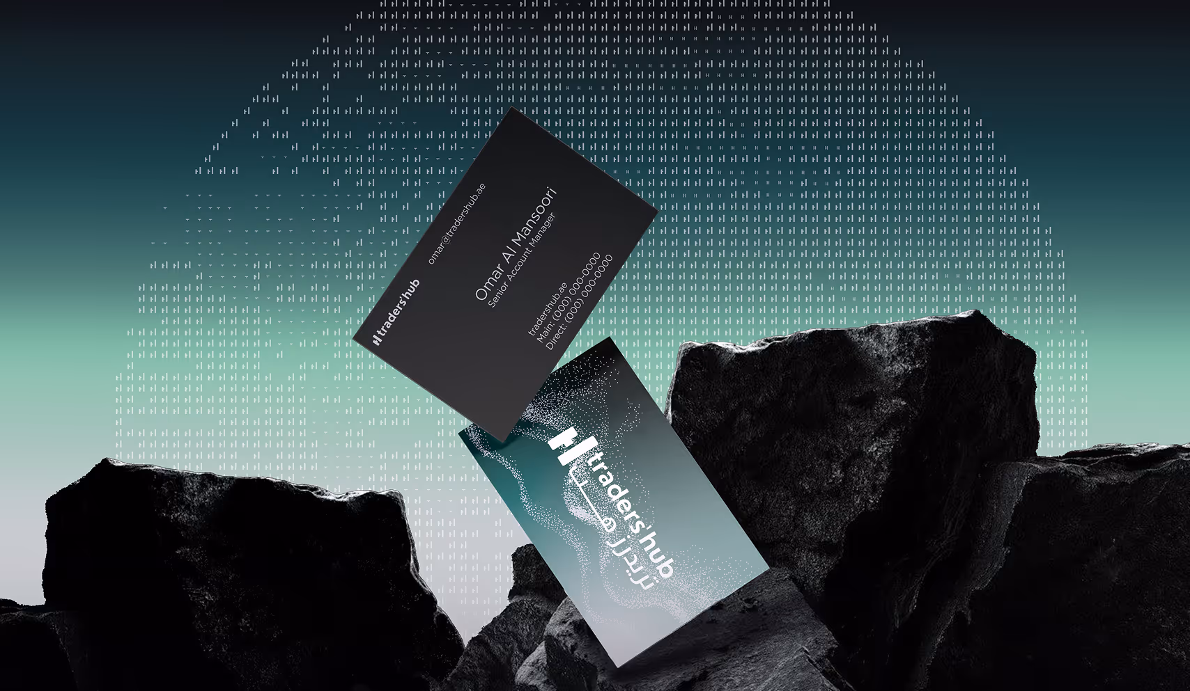 The image shows two business cards balanced on dark rocks. The background features binary code and a gradient from teal to black, creating a tech-inspired tone.