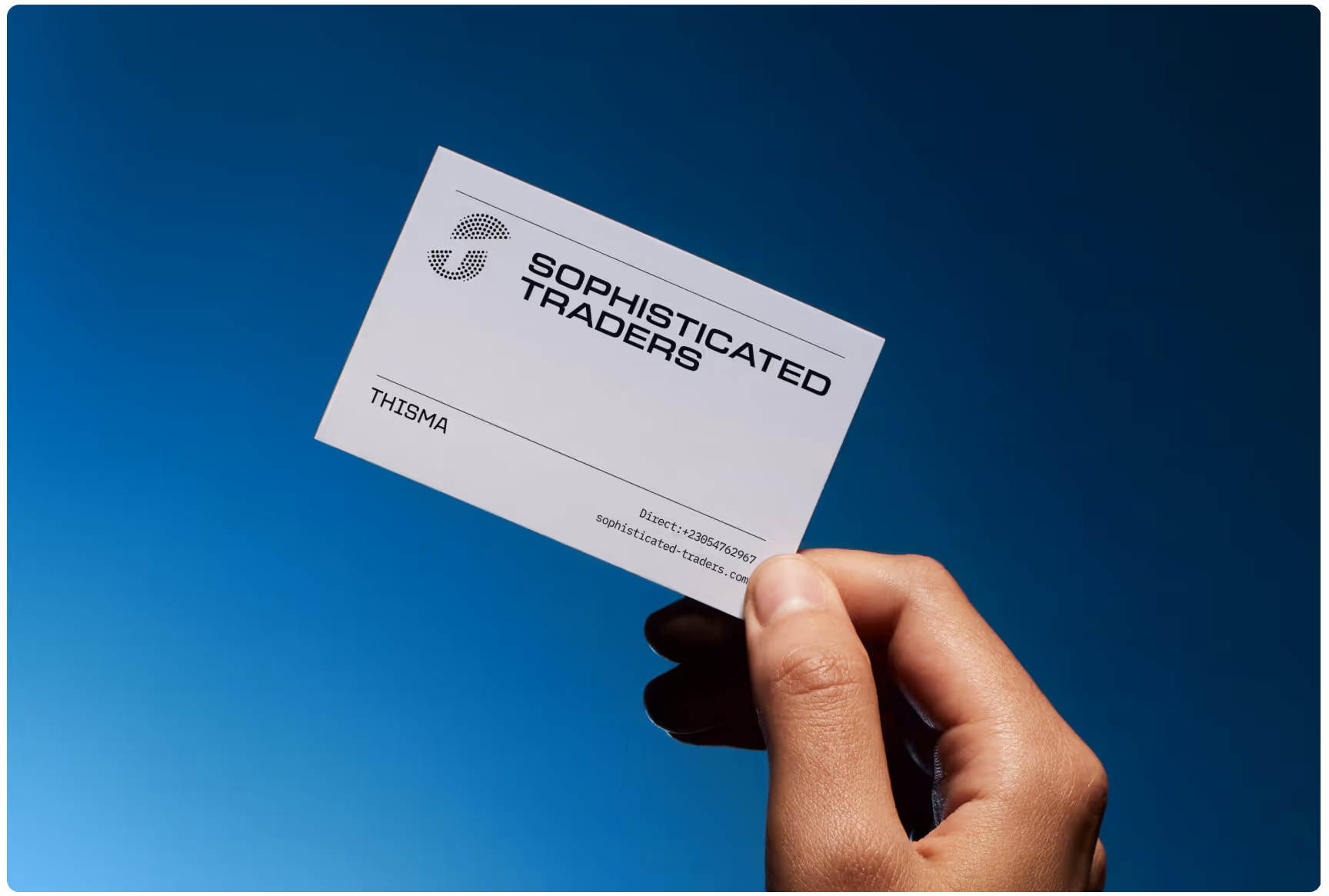 A hand holds a business card against a clear blue sky. The card, labeled "Sophisticated Traders," conveys a professional and modern tone.