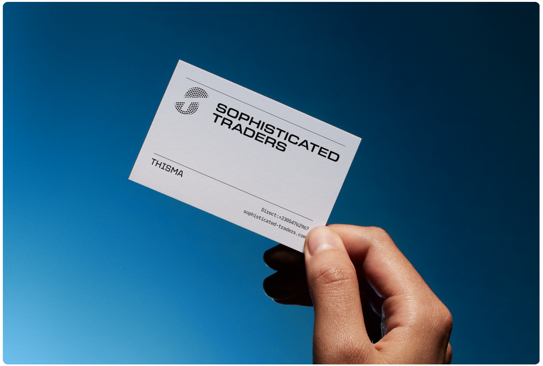 A hand holds a business card against a clear blue sky. The card, labeled "Sophisticated Traders," conveys a professional and modern tone.
