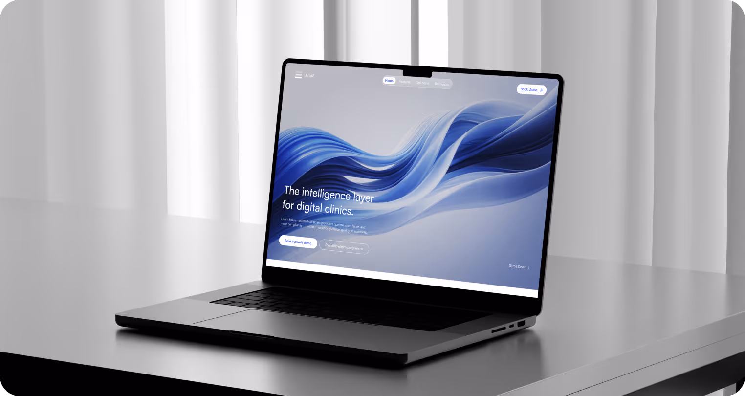 A sleek laptop displays a website with swirling blue waves on a modern desk. Text reads "The intelligence layer for digital clinics," conveying innovation.