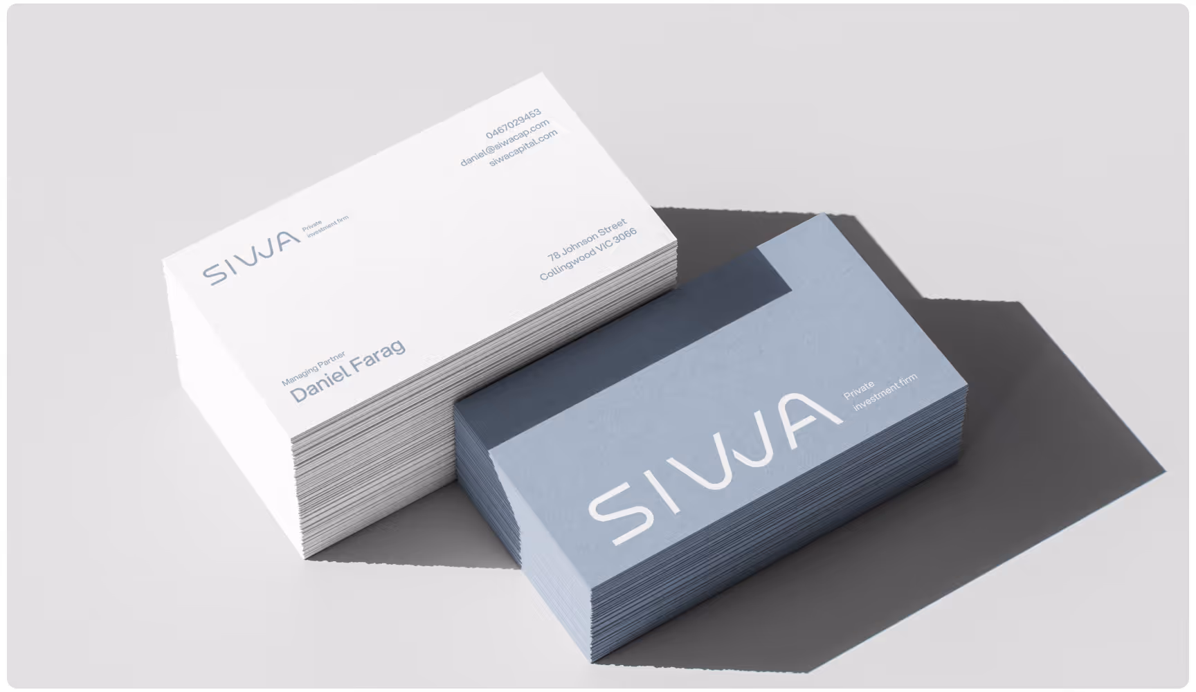 Two stacks of business cards, one white and one gray. The top card of each stack reads "SIWA" in bold letters. Sleek, modern design with shadows.