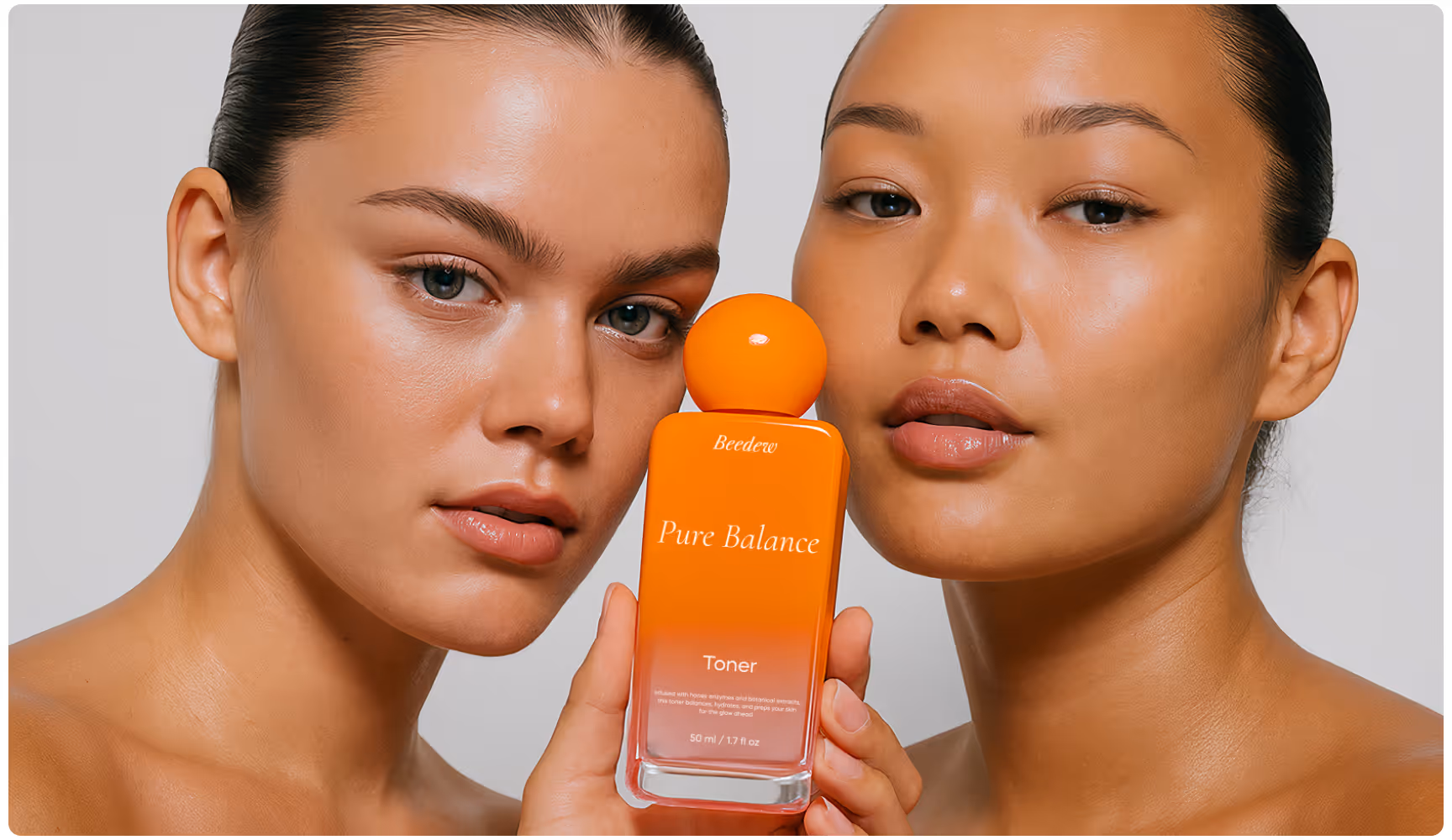 Two individuals with clear skin hold a bright orange bottle of "Pure Balance" toner, exuding a fresh and radiant feeling.