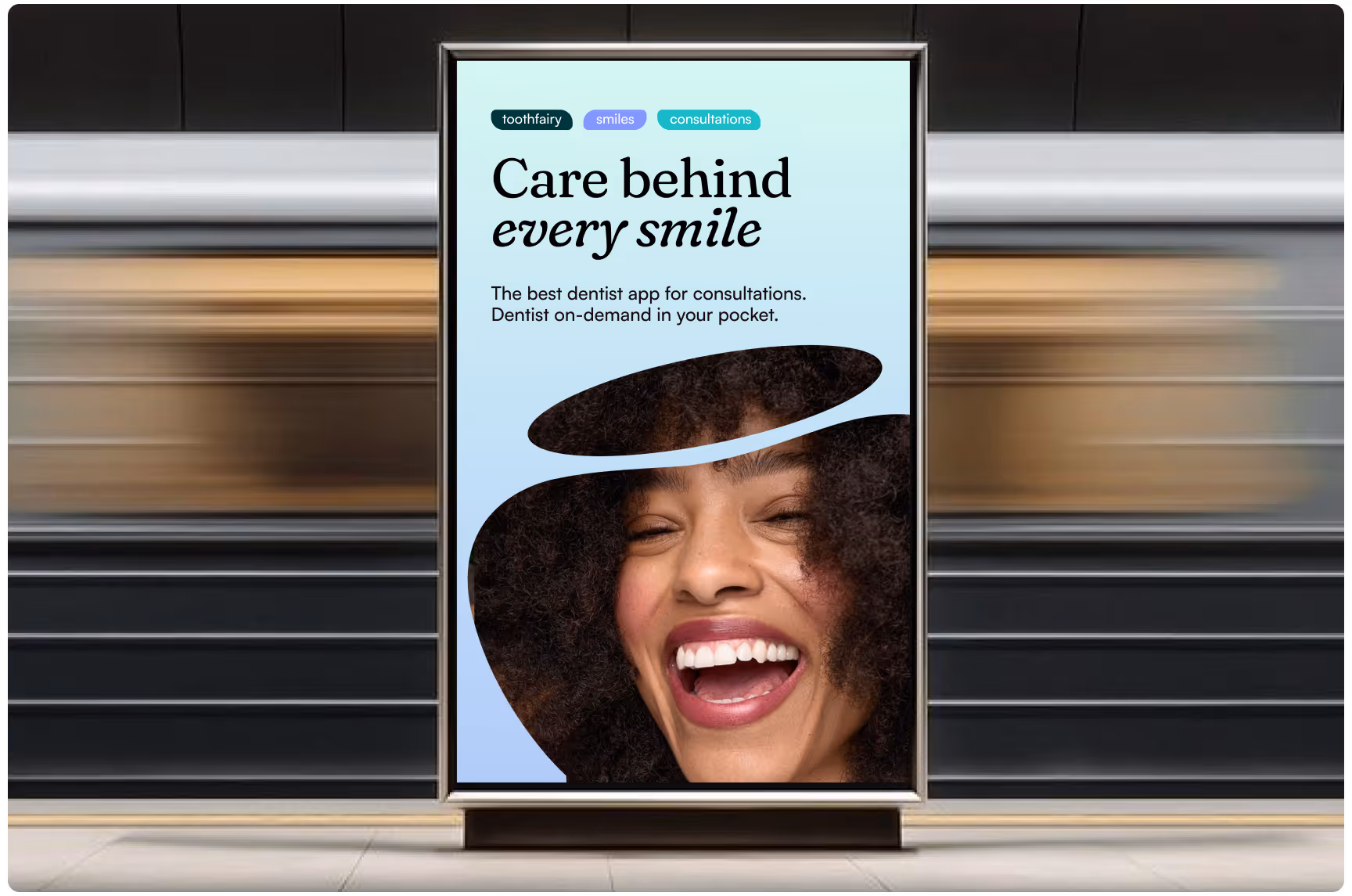 Transit station billboard advertisement for Toothfairy featuring a smiling person and the headline “Care behind every smile,” promoting on-demand dental consultations, accessible oral healthcare, and convenient dentist access through a mobile app.