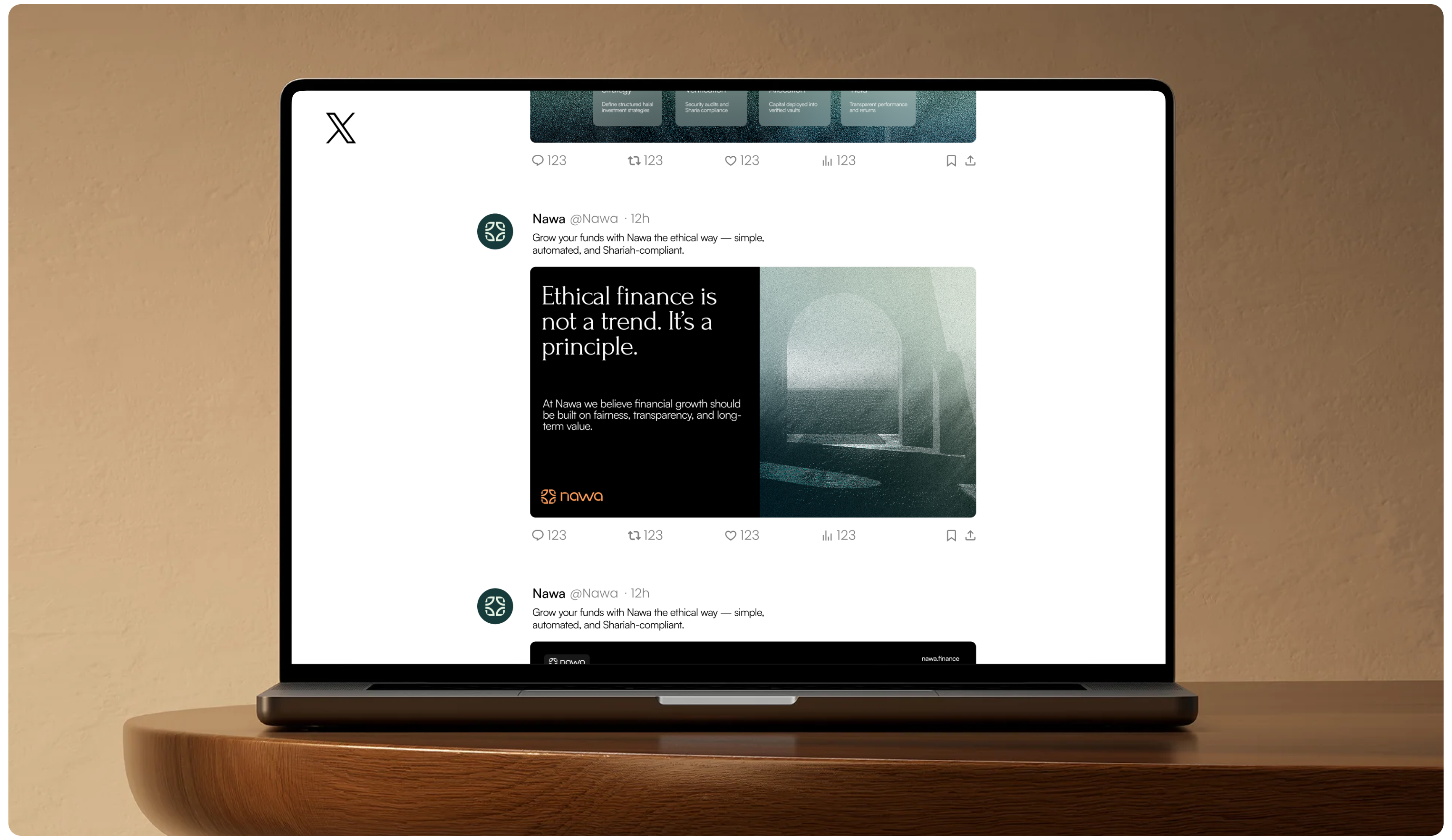 Laptop on a wooden desk displays an X social media feed with a dark post about ethical finance beside a misty landscape; calm, reflective tone.