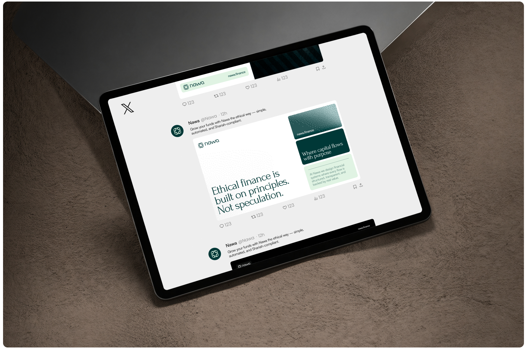 Tablet displaying a social media post about ethical finance and sustainability, resting on a textured surface in a calm, professional setting.