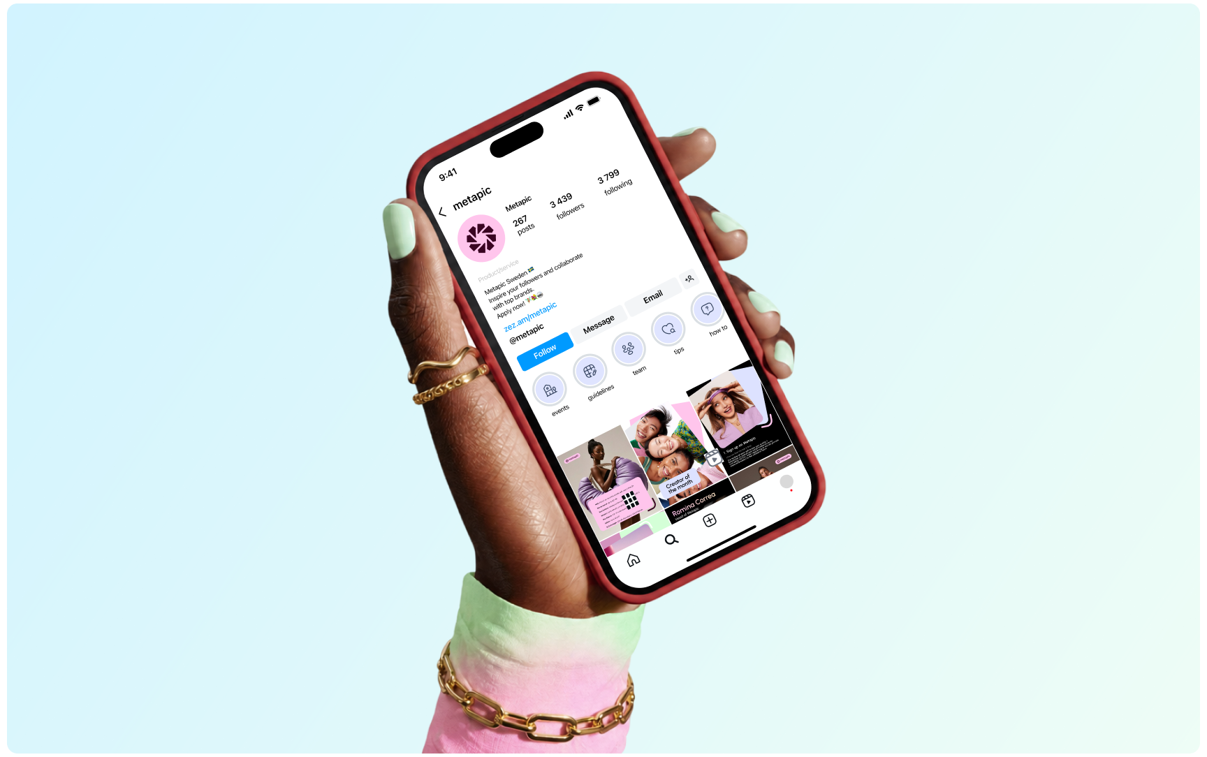 A hand holding a smartphone displaying the Metapic Instagram profile page against a soft pastel blue background.