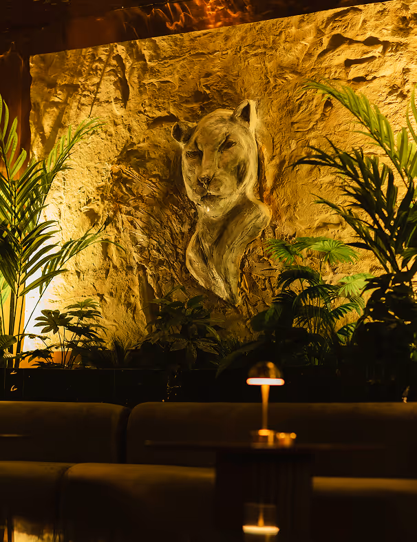 Luxurious lounge with lioness wall sculpture