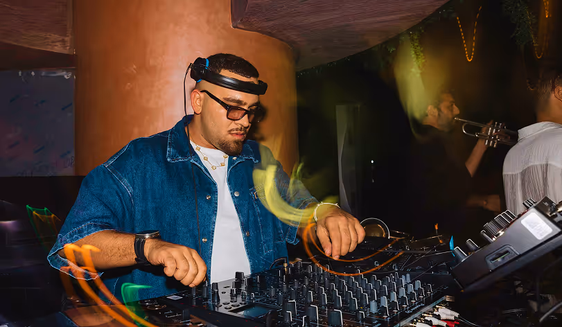 DJ mixing music at nightclub event