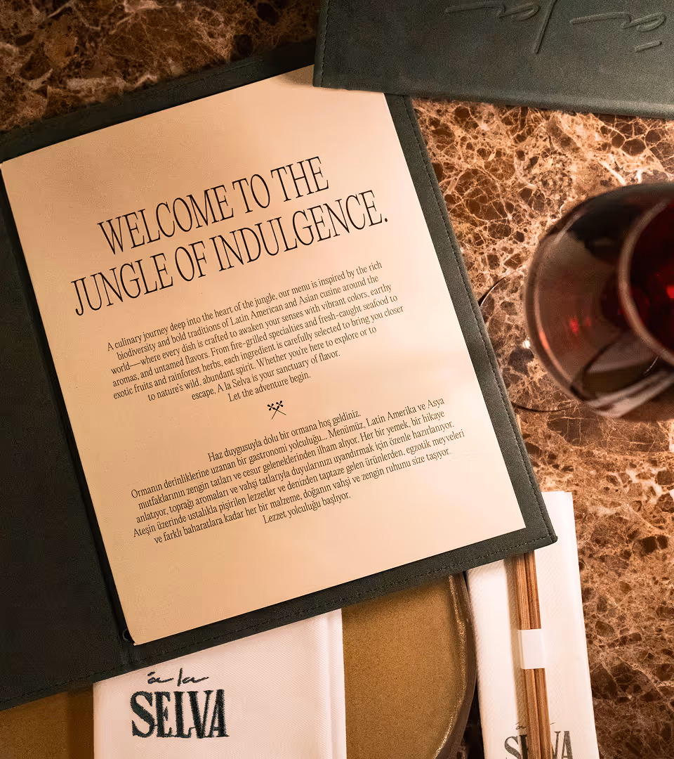 Selva lounge menu on marble table with wine