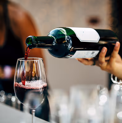 Red wine being poured into a glass