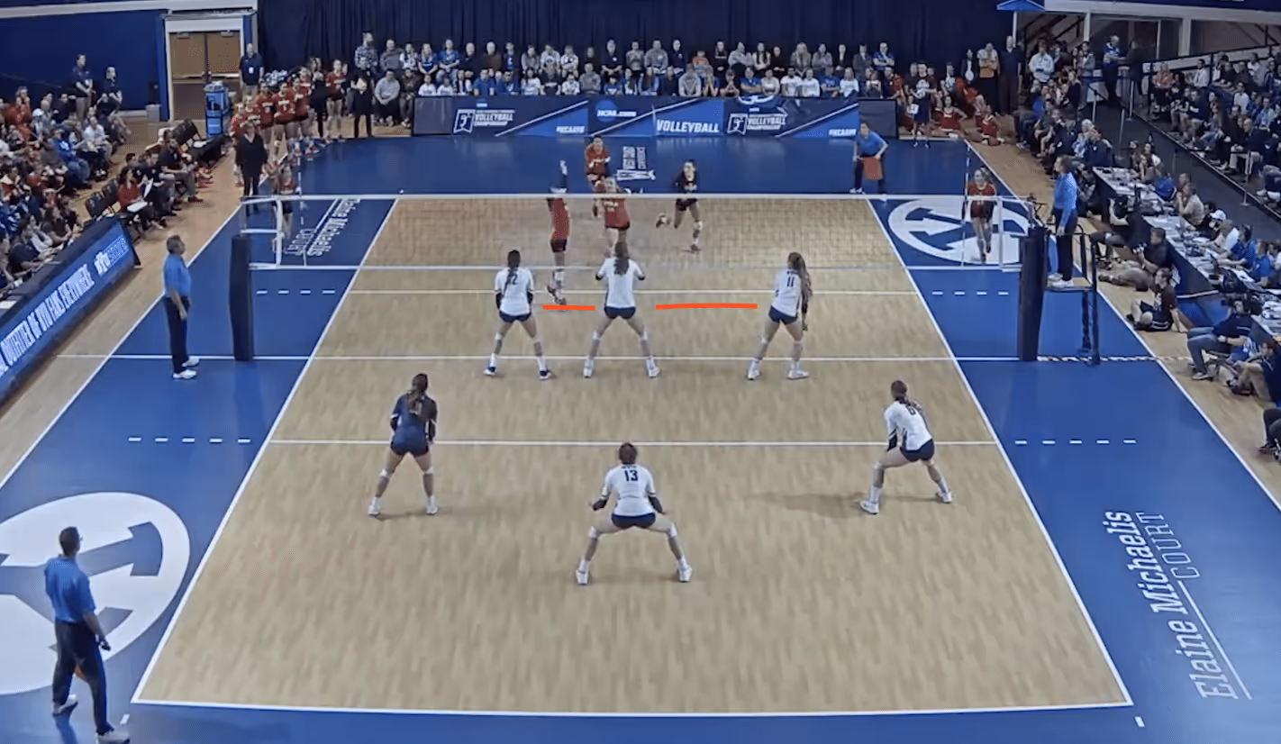 an image of a team blocking in volleyball