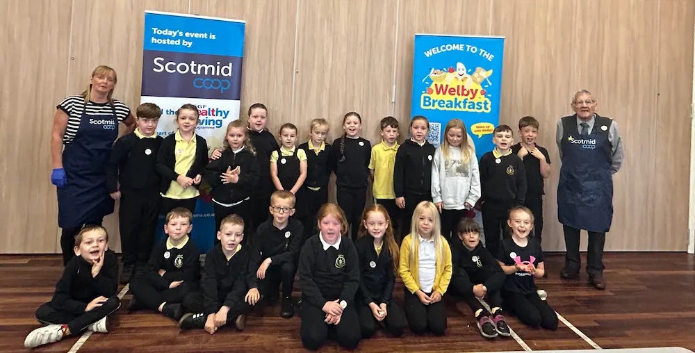 Logan Primary School pupils and Scotmid volunteers at a Welby Breakfast event