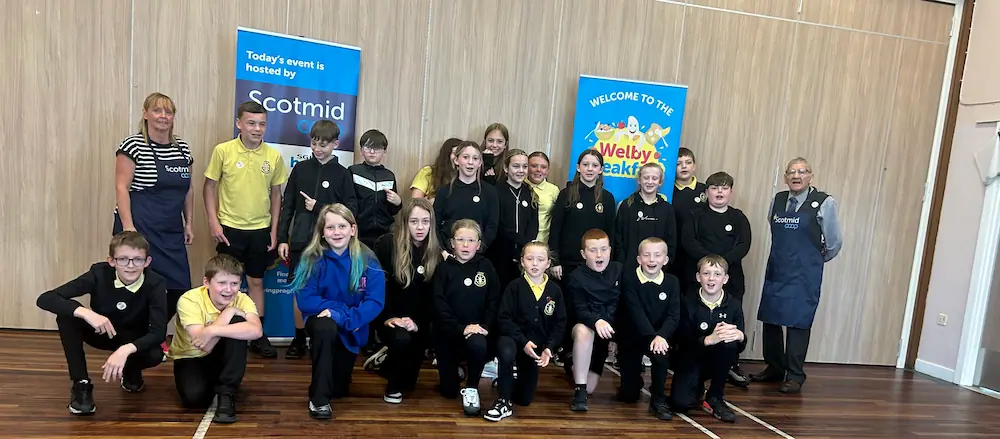 Logan Primary School pupils and Scotmid volunteers at a Welby Breakfast event