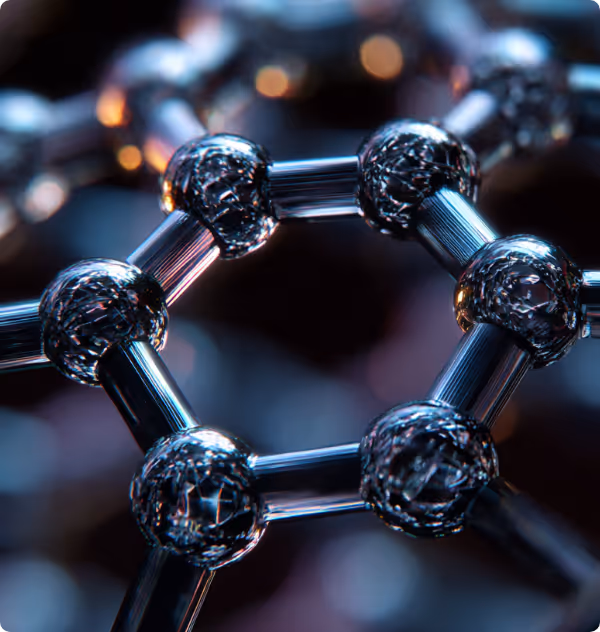 Close-up of a hexagonal graphene molecular structure with connected spherical atoms and rods.