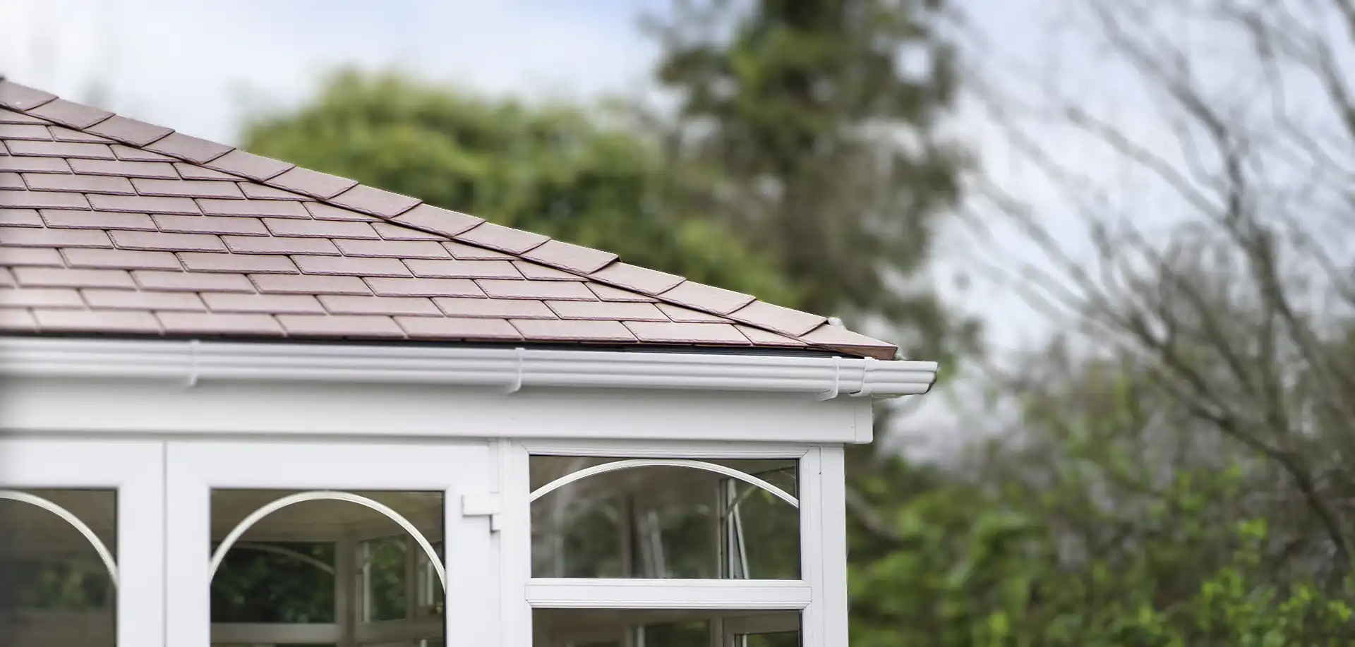 Exterior photograph of a conservatory with a WarmerROOF