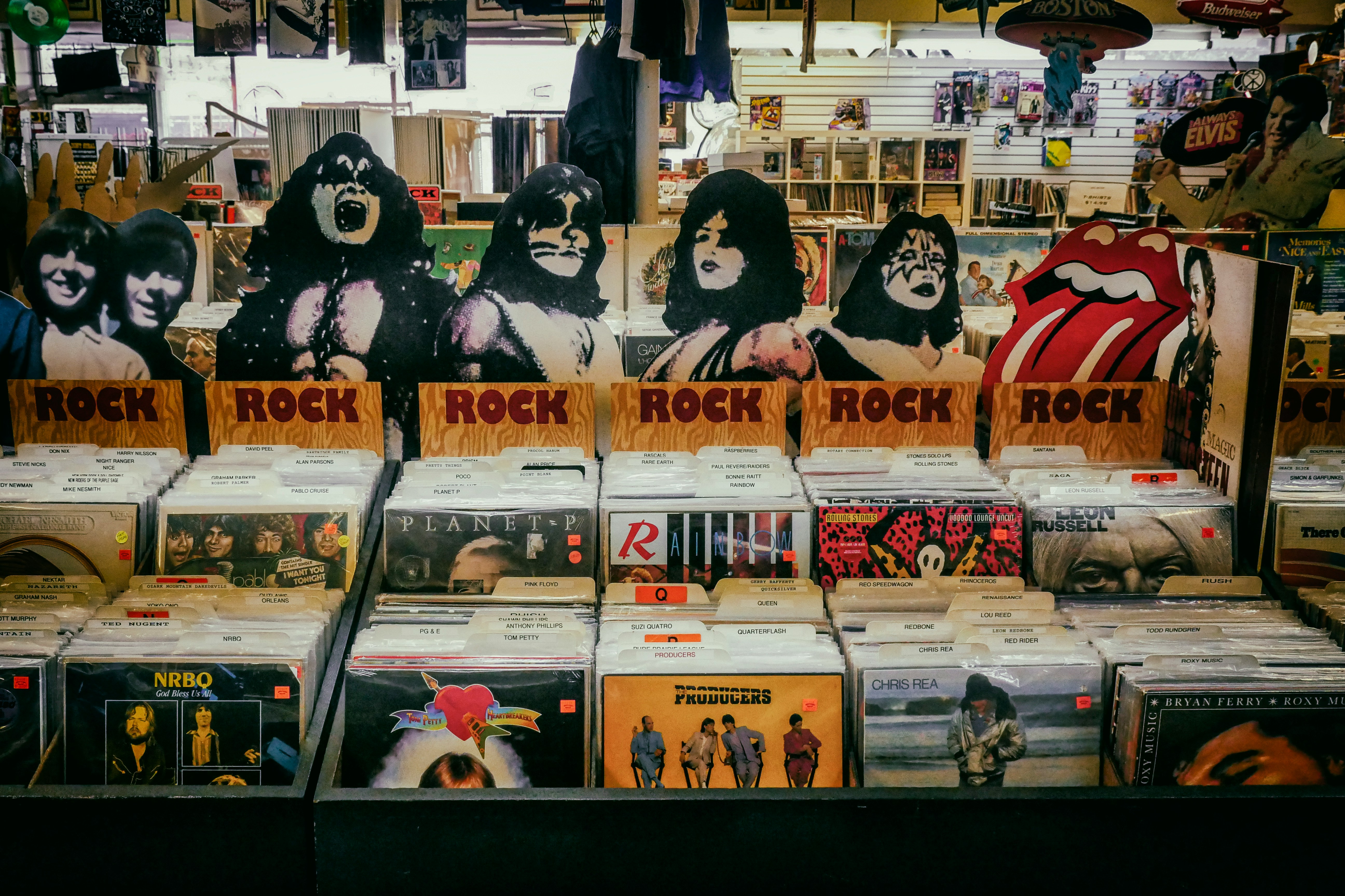 Inside a record store with images of KISS members prominently featured