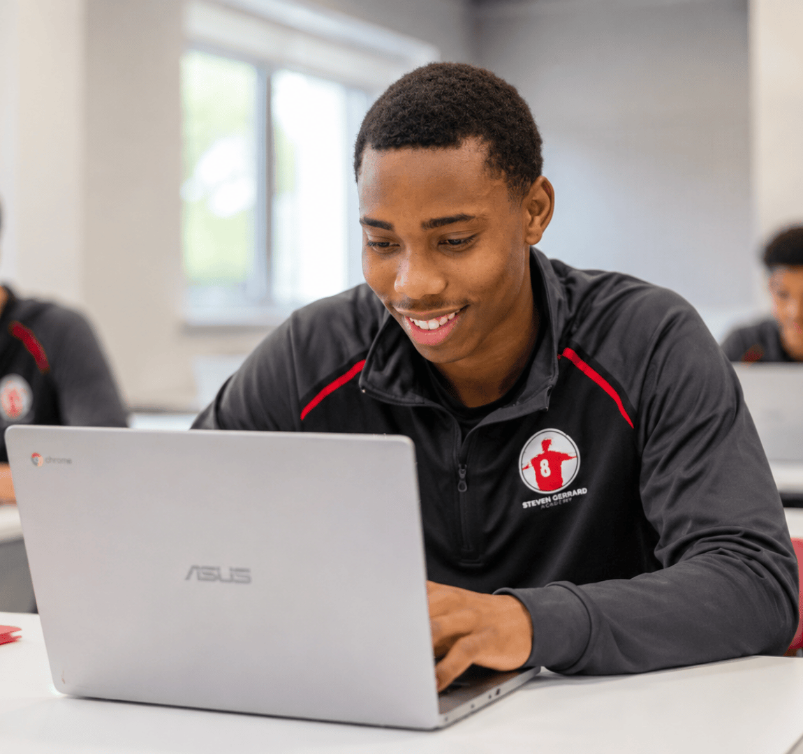 SGA students working together on laptops in the classroom