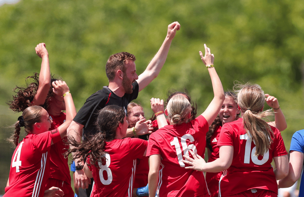 Girls football team huddle