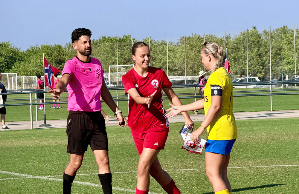 Female player competing in a football match