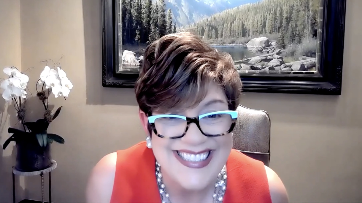 A businesswoman with glasses leading a seminar in a virtual workspace