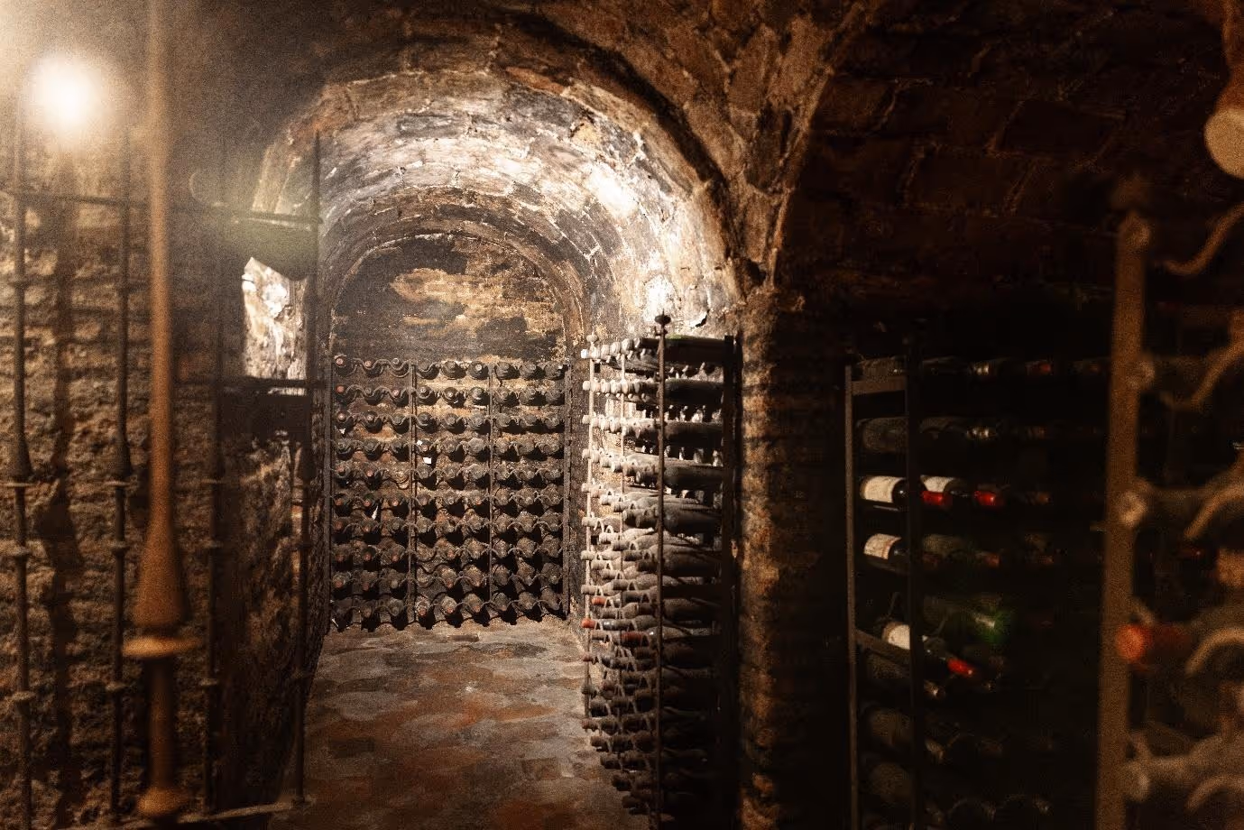 A wine cellar with wine bottlesAI-generated content may be incorrect.