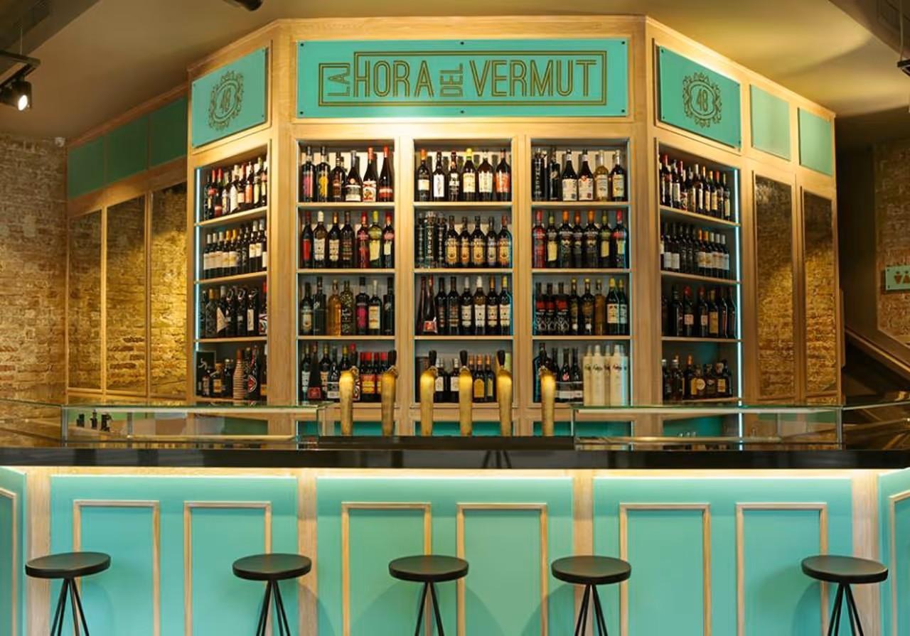 A bar with shelves of liquorAI-generated content may be incorrect.