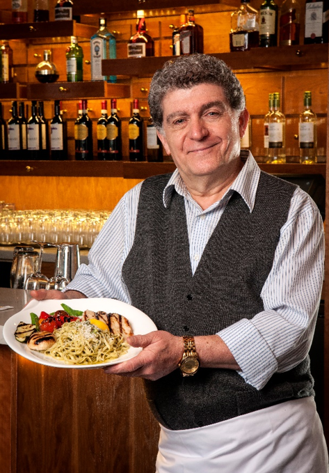 Chef holding a plate of food