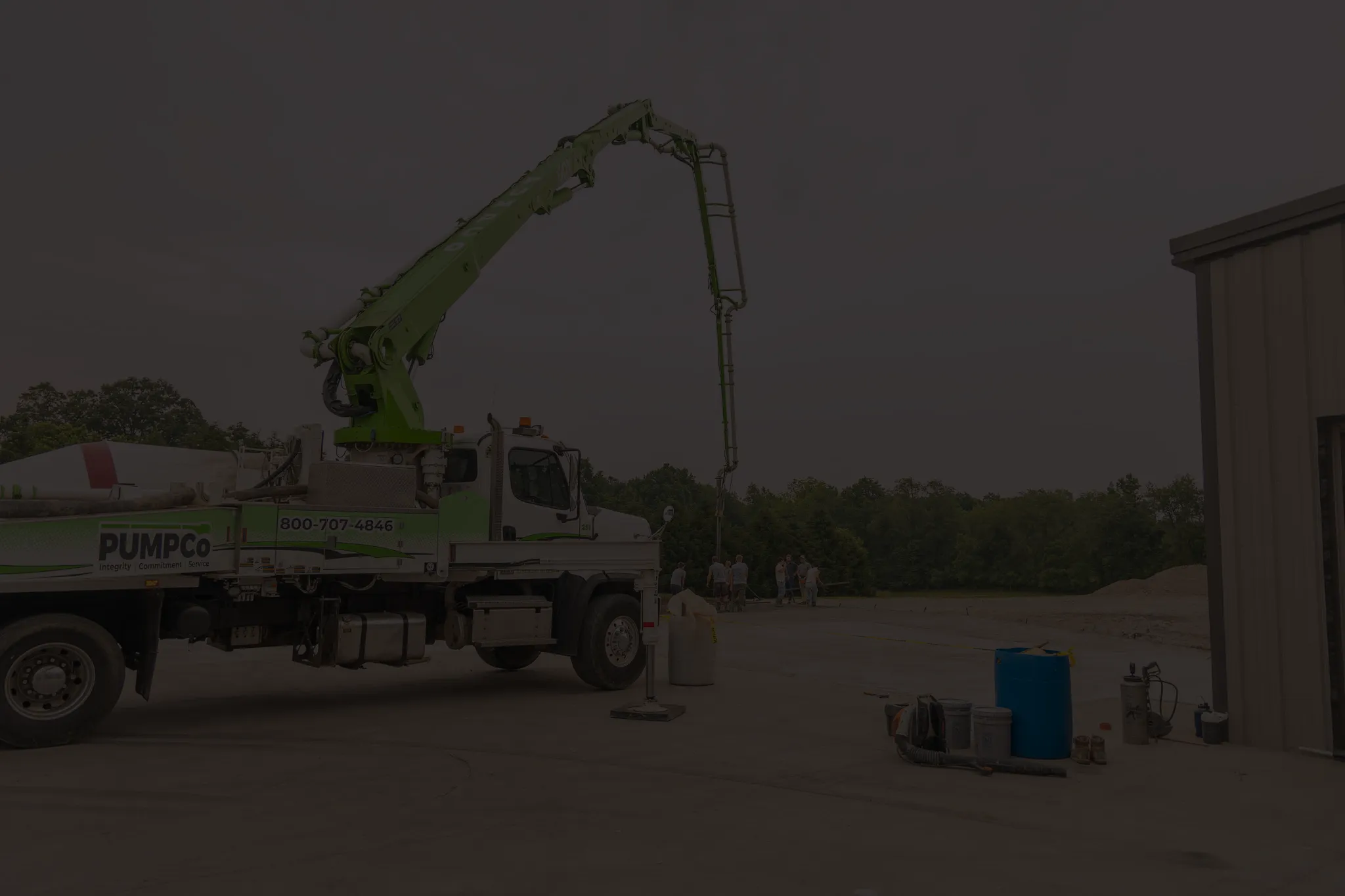 boom truck with workers in background with overlay