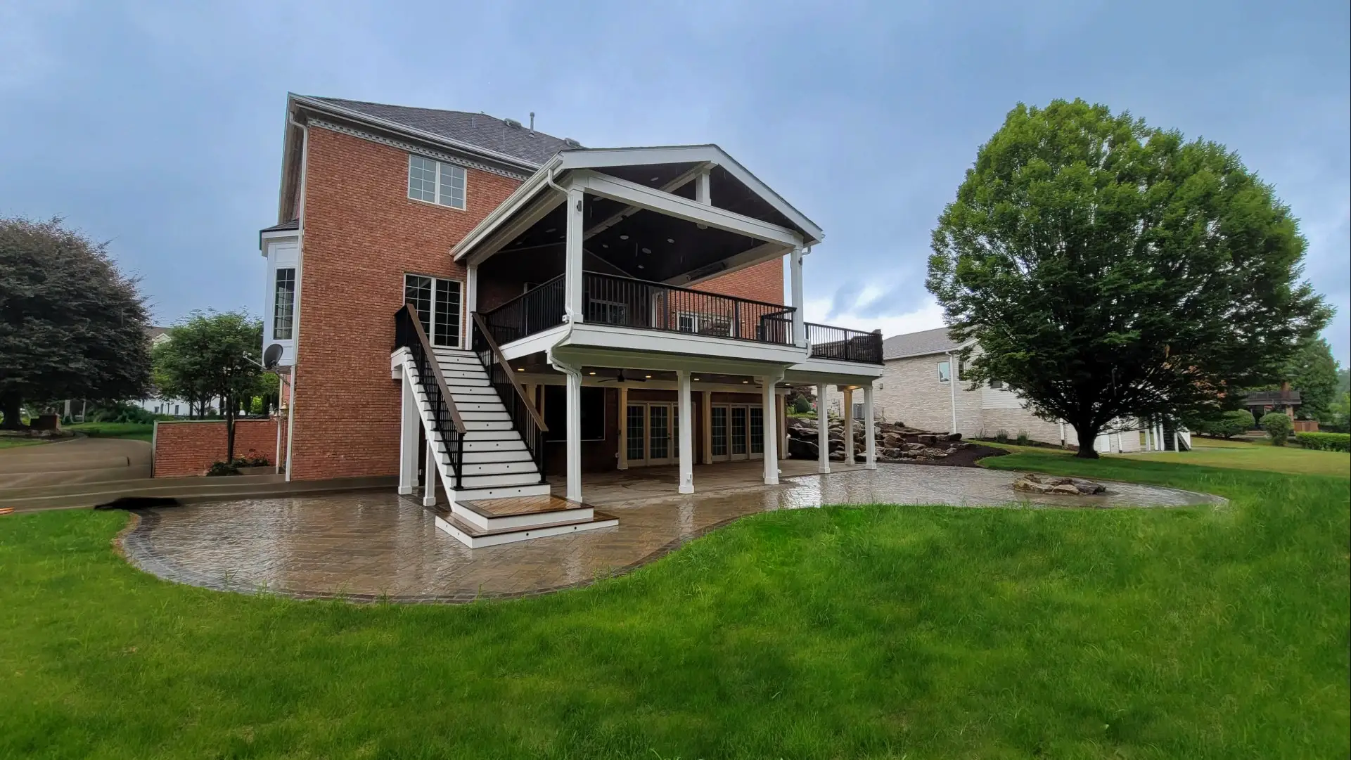 Backyard transformation with covered deck, outdoor kitchen, and patio in Jefferson Hills, PA