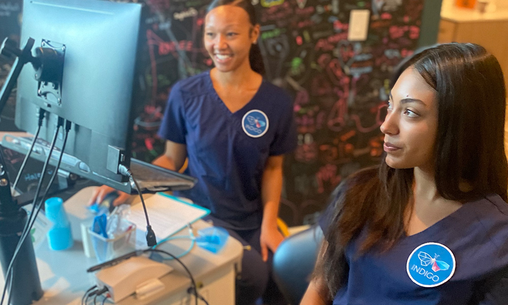 Dental assistants practicing procedure