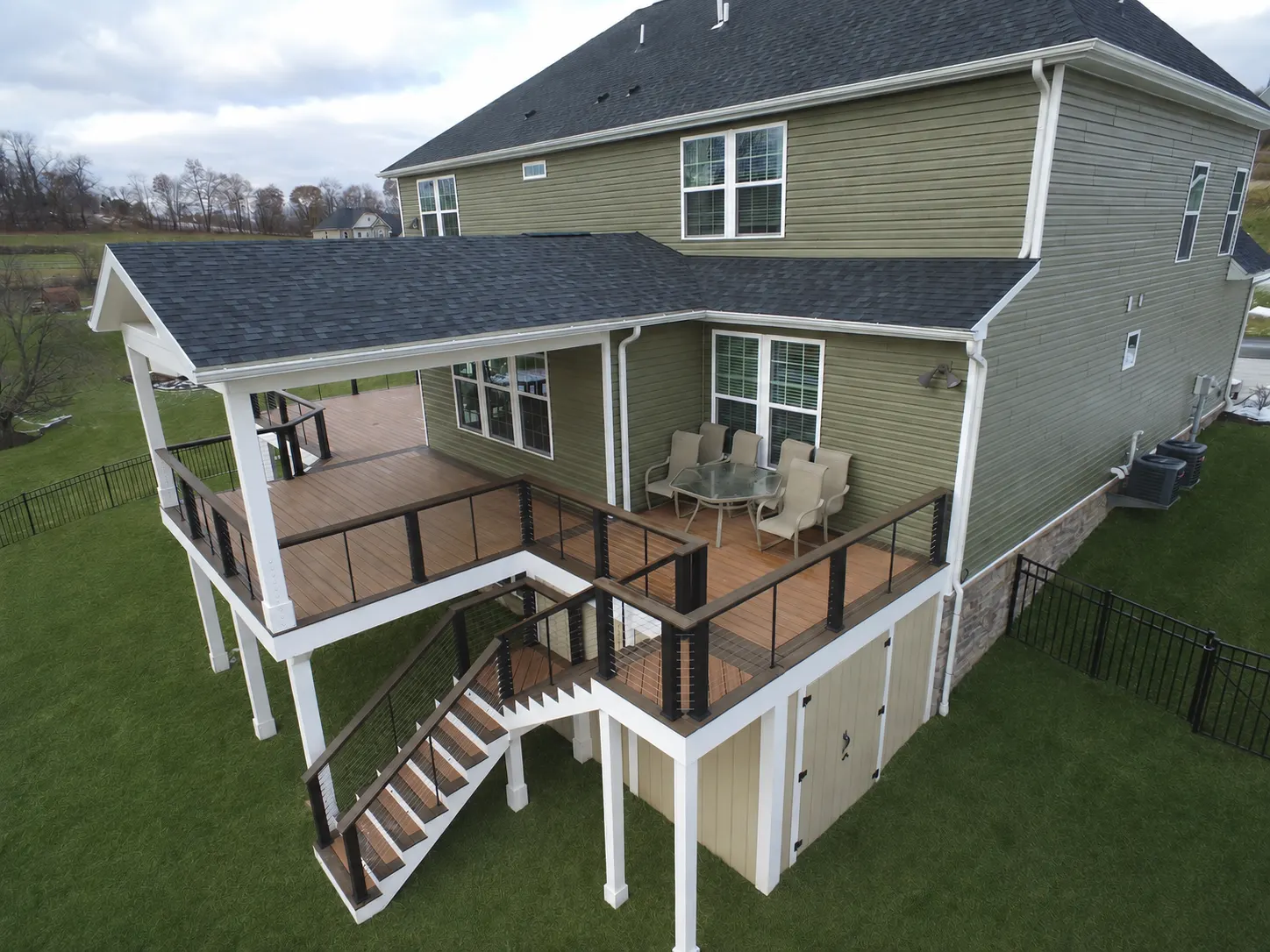 Covered deck with cable handrails