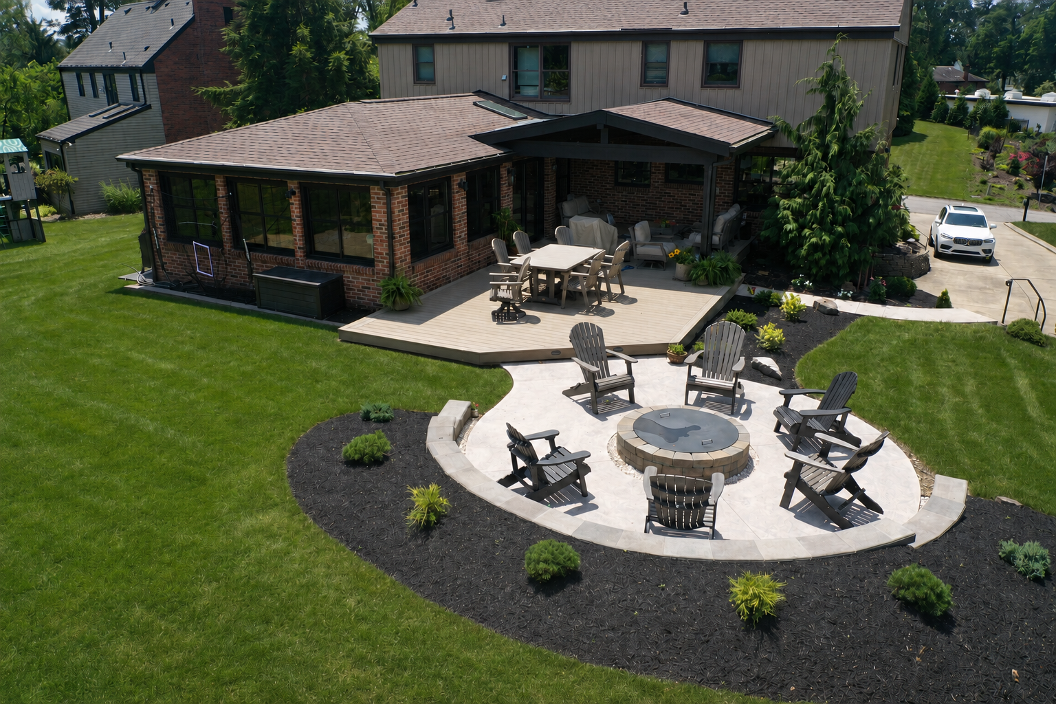 covered deck and patio with fireplace and furniture