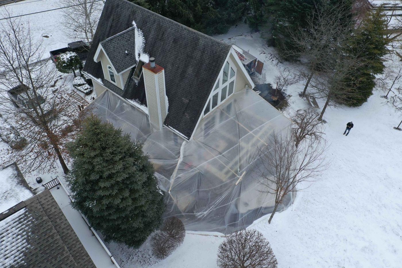 winter enclosure built around a deck under construction in Pittsburgh