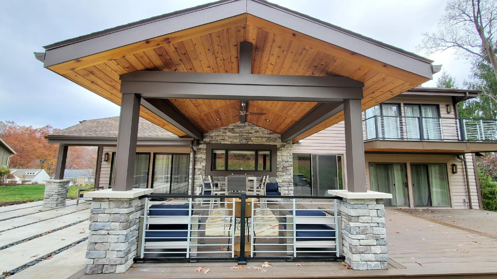 covered deck with cedar ceiling and stone columns in fall in Pittsburgh