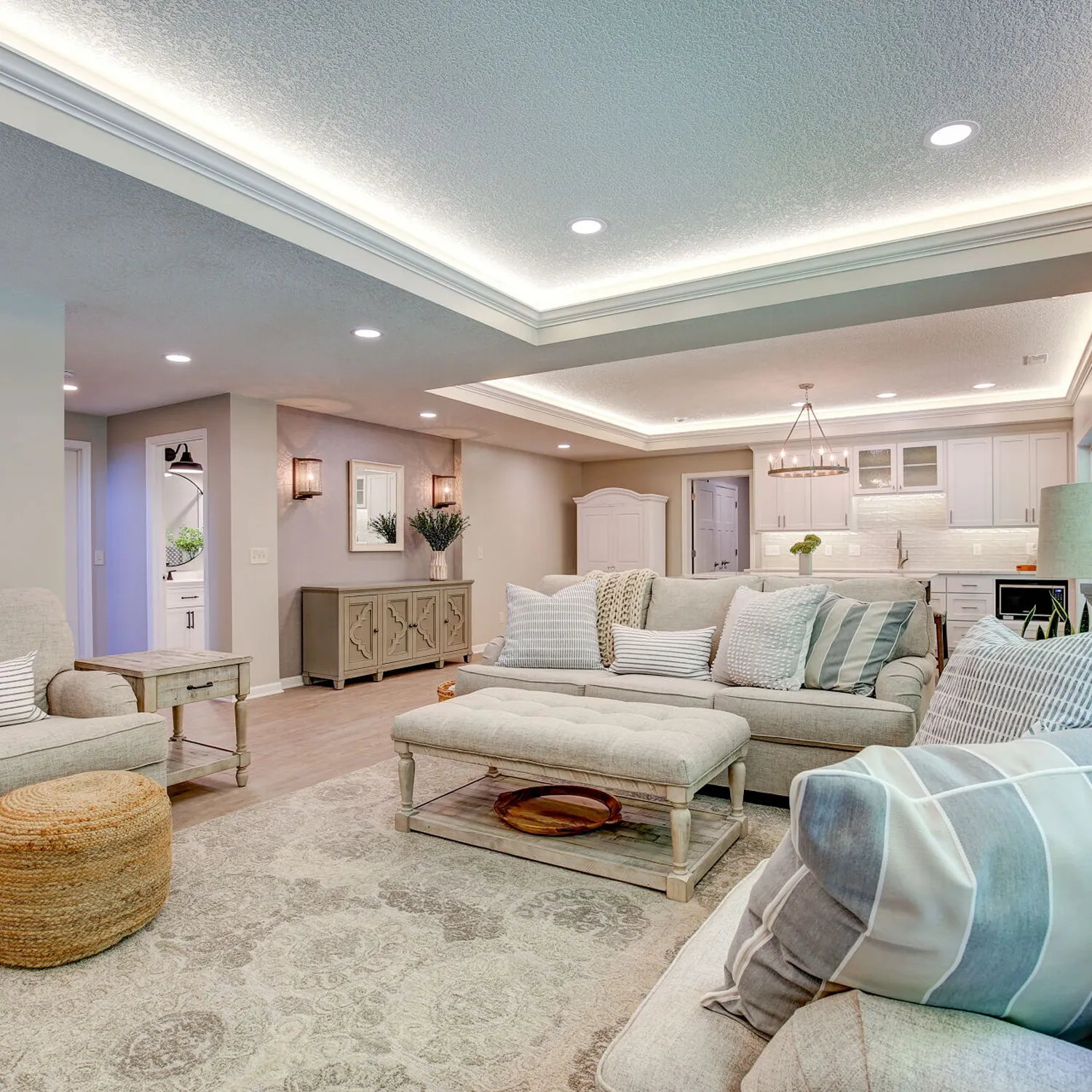 Open concept living room with full electrical lighting remodel and LED tray ceiling