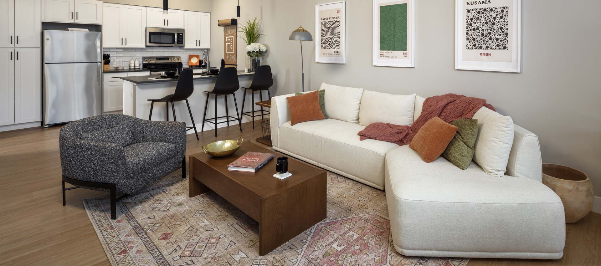 One-bedroom apartment living room with open kitchen and dining area