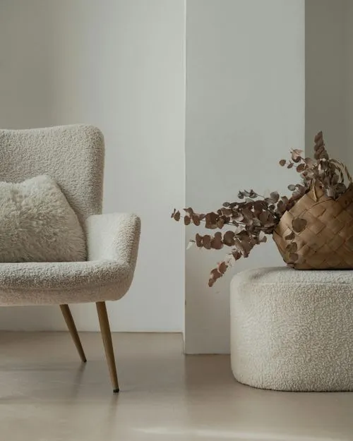 White chair next to plant