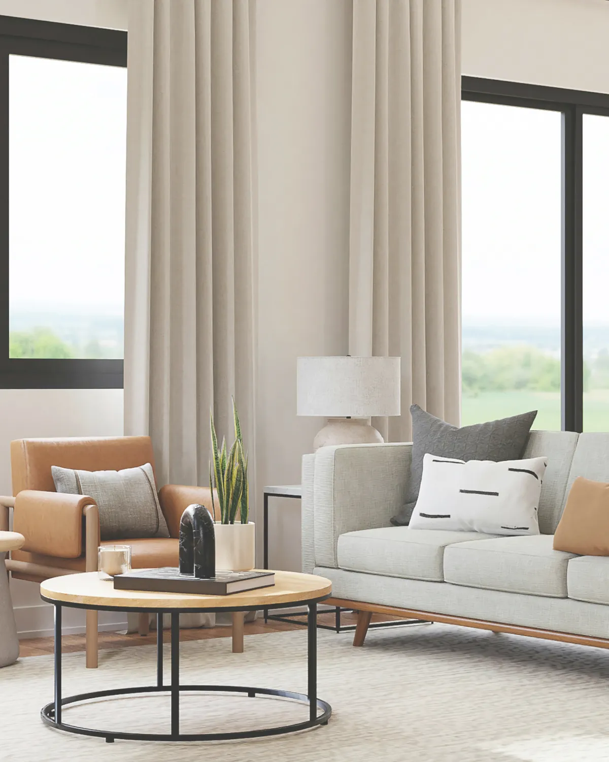Tan living room with large black windows