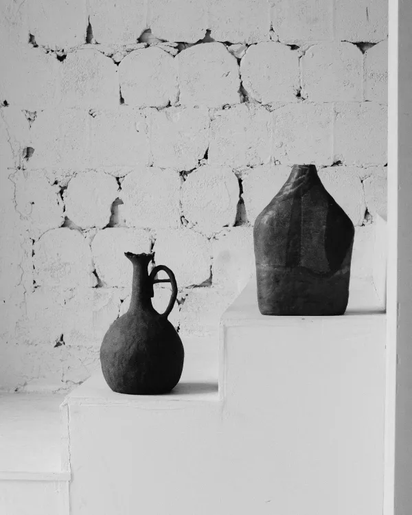 Two vases on white stairs