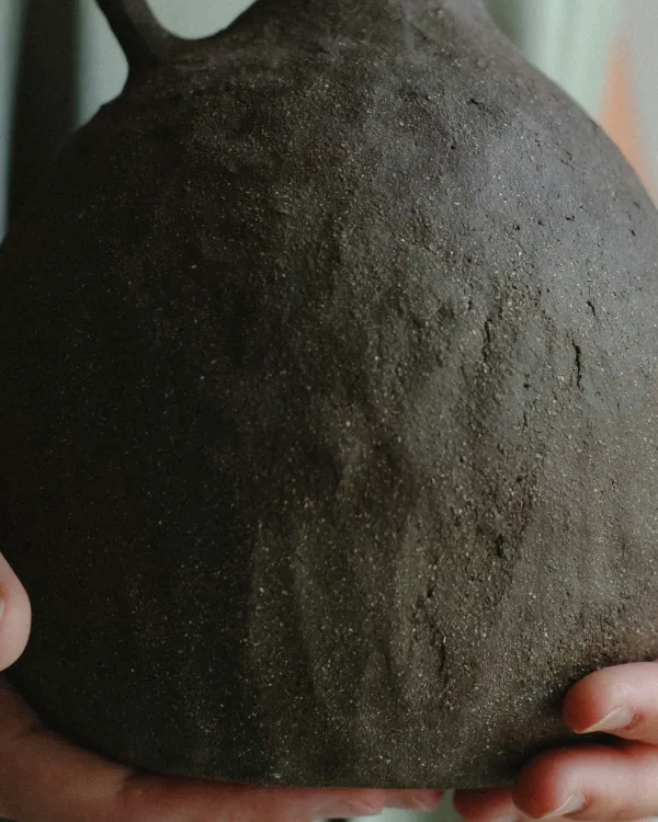 Vase in the hands of a person