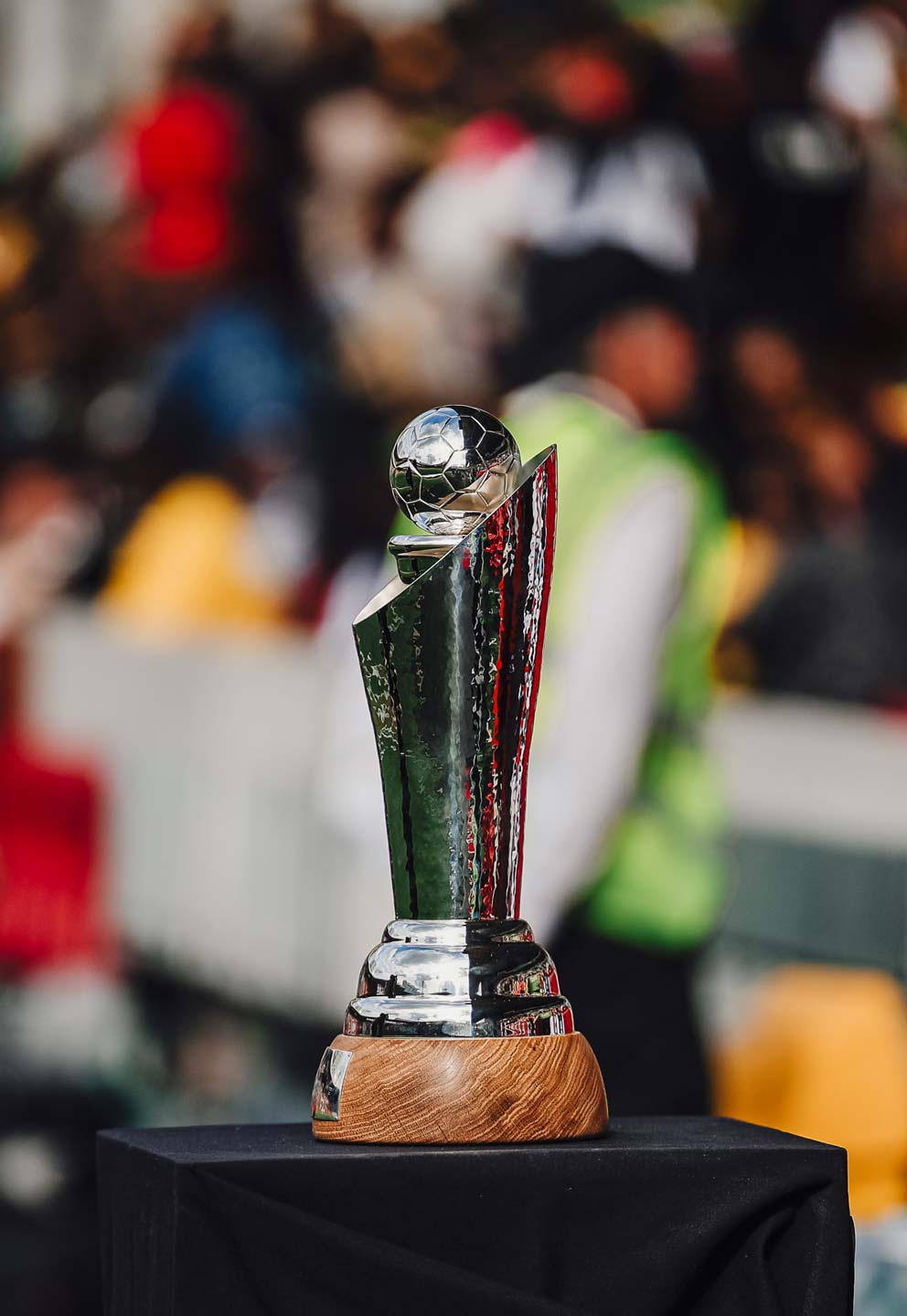 The Unity Cup pitchside in front of a crowd.