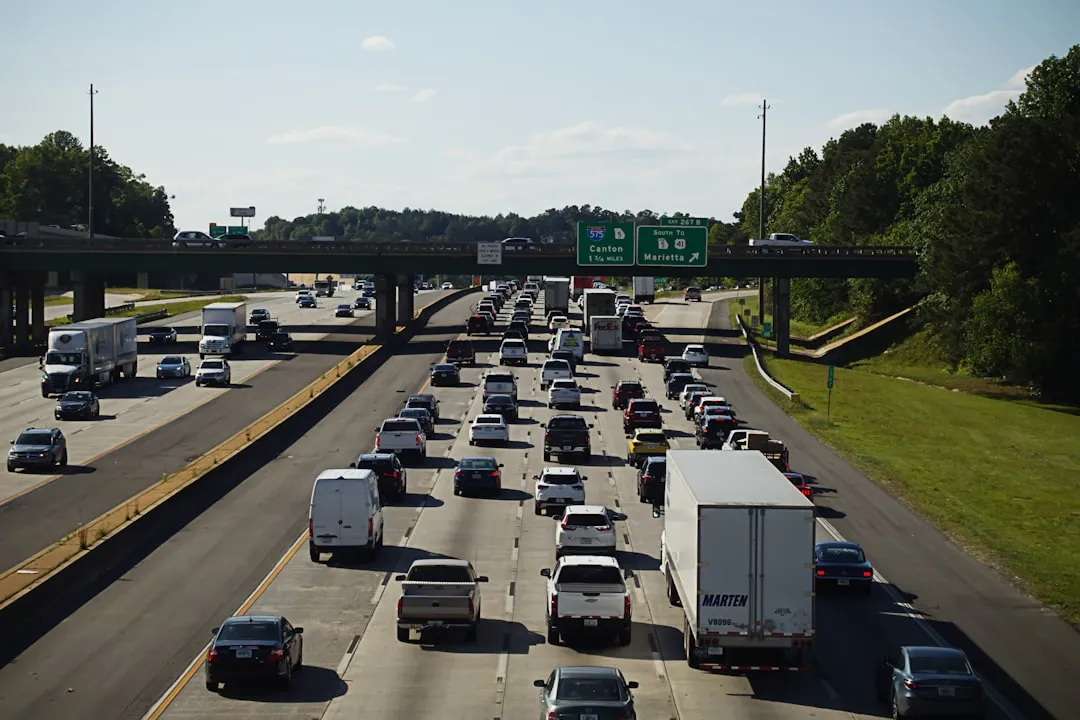 Traffic on I-35 in Austin during rush hour, showing a dense line of cars and trucks contributing to vehicle emissions. - Austin air quality