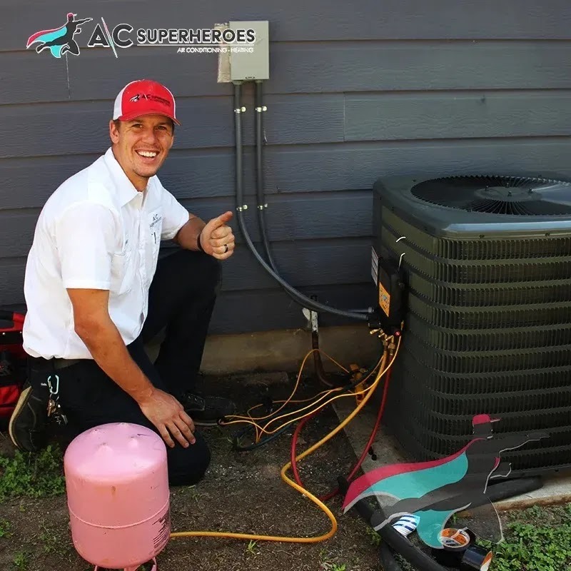 Technician performing HVAC tune-up in a residential setting